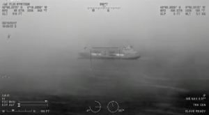 The crew of the Newquay coastguard helicopter flies through dense fog to a cargo ship