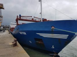 The blue hull of a motor yacht which a captain ran aground in Northern Ireland