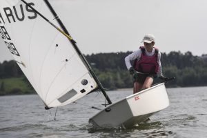 child sailing in an optimist dinghy