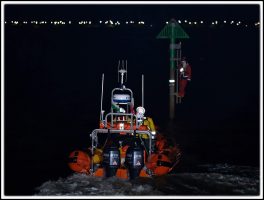 santa clinging to a pole in Porthcawl marina