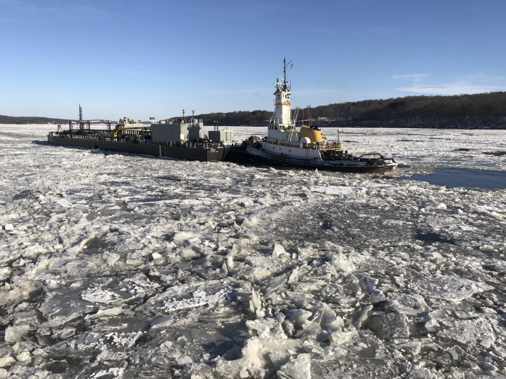 Coast Guard Cutter breaks tug free from ice in New York following snow storms