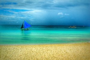 boat sailing in blue sea