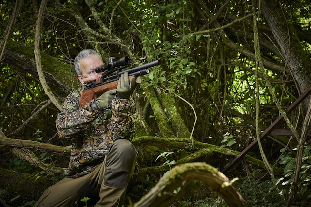 man shooting air rifle