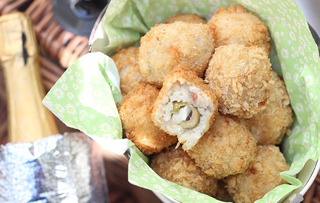 Pancetta and rosemary arancini stuffed with olives and mozzarella