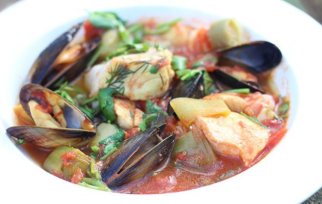 Fish stew with spring onions, leeks, saffron and watercress