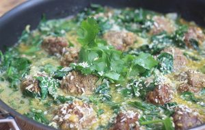 Venison meatballs with ginger, coconut and spinach