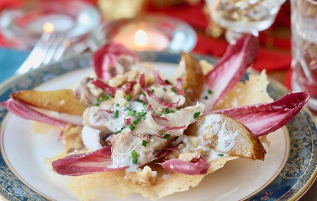 Warm partridge salad with pear, brandy and walnuts in parmesan bowls
