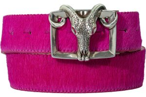 A metal ram's head belt buckle on a bright pink leather belt