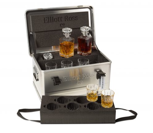 A metal decanter box complete with glasses and decanter