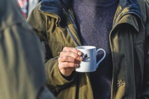 man holding a mug