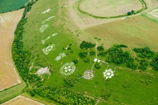 Regimental badges carved into a chalk hill,