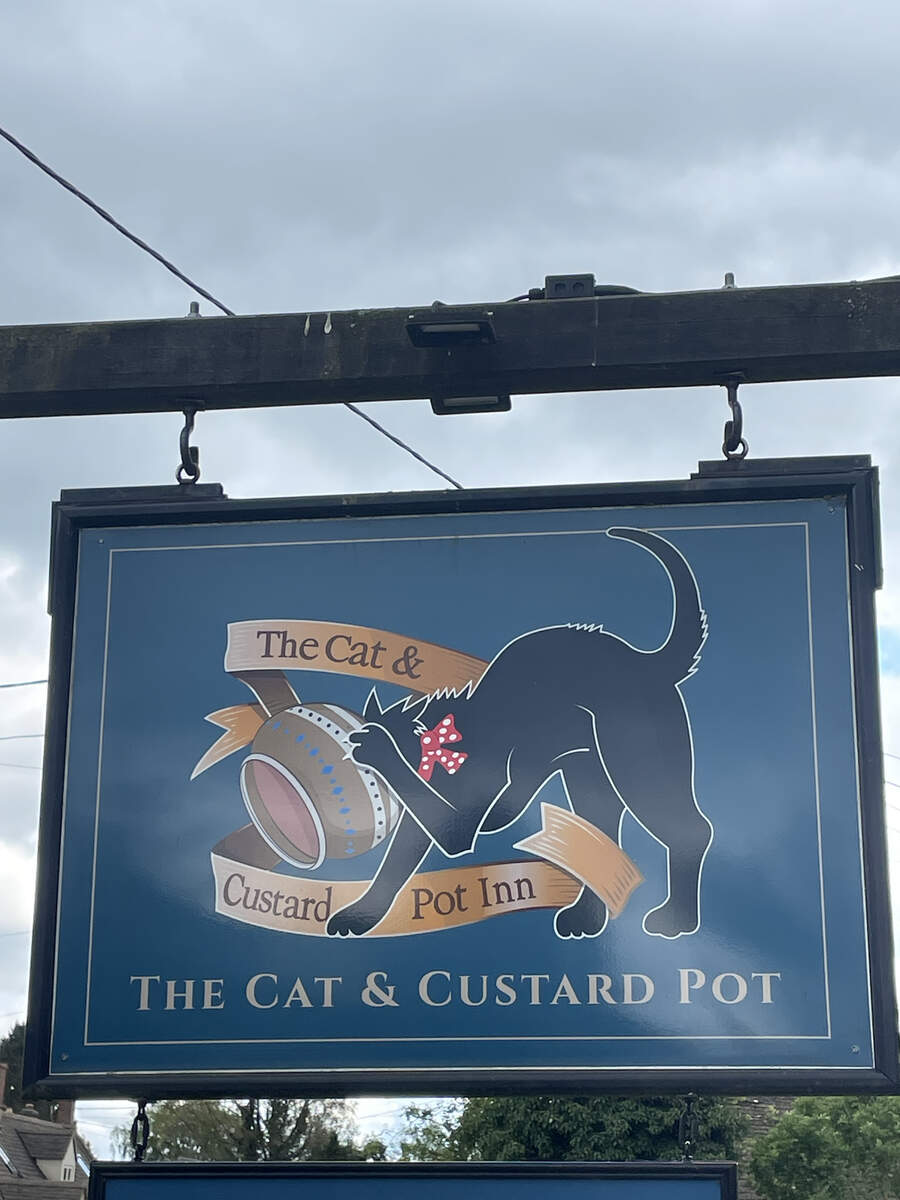 Cat & Custard Pot signpost