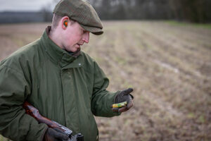 examining a shotgun cartridge