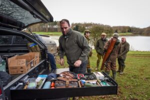 Man at boot of car on game shooting day