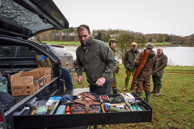 Man at boot of car on game shooting day