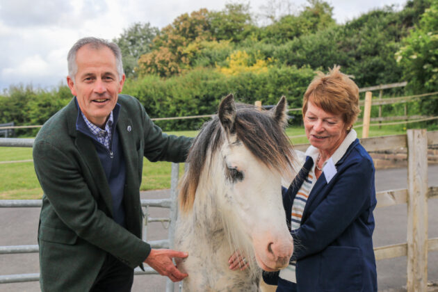 man and woman with pony