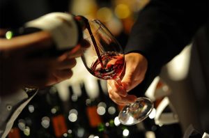 Pouring a glass of red wine