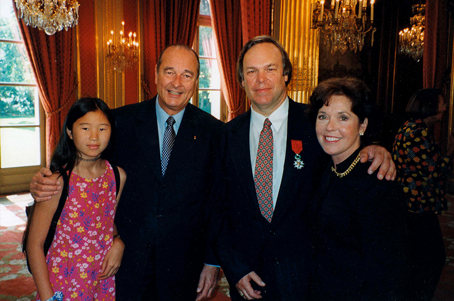 on receiving the Légion d’Honneur in June 1999, Parker and former French president Jacques Chirac, with wife Patricia (right) and their daughter