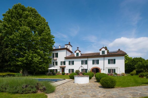 The villa and pool of the Piedmont wine property.
