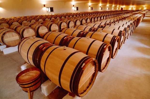 Barrels of wine ageing at Château Mouton Rothschild in Bordeaux.