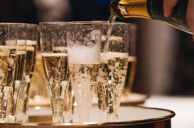 sparkling wine is poured into glasses