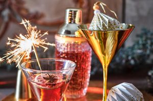 Cocktail, shakers and sparklers on a table