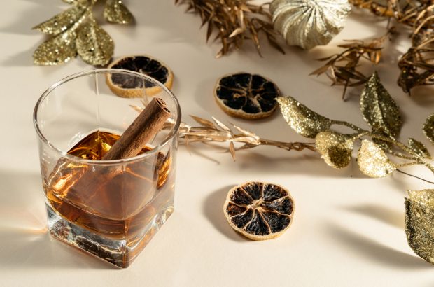 Glass of whisky with Christmas decorations