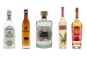 Five bottles of Tequila against a white background