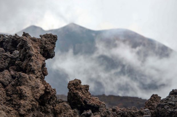 Etna volcano, Sicily, volcanic rock in foreground