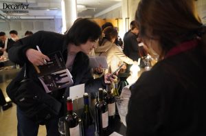 Guest taking photo of the featured wines at the Walk-around Tasting in Seoul