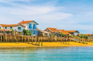 Beachside houses and oyster bars in Piraillan, on the Cap Ferret peninsula.