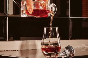 The Last Call cocktail, a popular after-dinner choice on the list of the American Bar at The Savoy, being poured into a glass