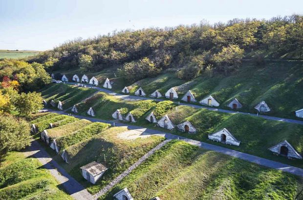 The rows of Hobbit hole-like wine cellar entrances at Hercegkút