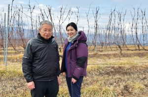 Grace winemaker Anaya Misawa and her father, fourth-generation owner Shigekazu Misawa, in front of some of their VSP plantings