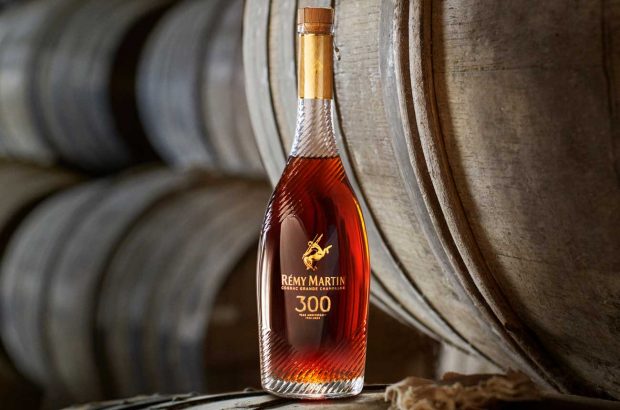 A bottle of Rémy Martin 300th Anniversary Coupe in a barrel cellar