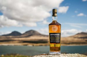 A bottle of Inaugural Release from Ardnahoe with loch in background