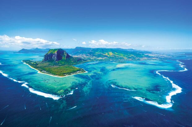 Aerial view of Mauritius from the southwest, with Le Morne Brabant peninsula and basalt monolith to the left and the ‘underwater waterfall’ in the centre.
