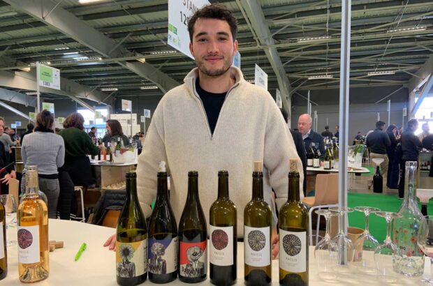Roman Tournier showing his wines made from Piwi grapes at Millésime Bio wine fair 2025.