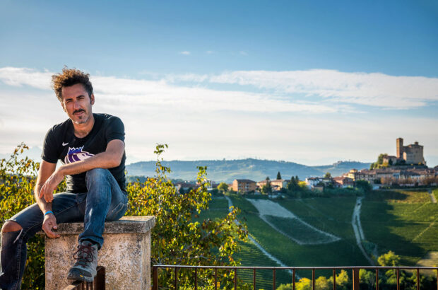 Enrico Rivetto, with the Barolo township of Serralunga d'Alba in the background.