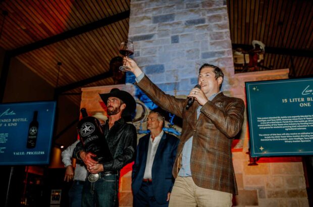 Image of people on the Texas Wine Auction stage during the auction's final lot.