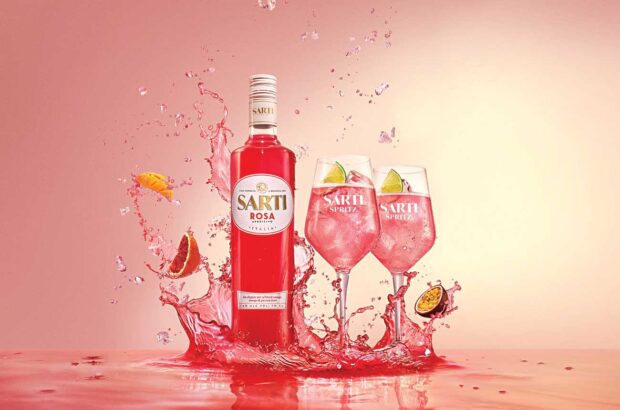 Bottle of Sarti Rosa spritz and glasses