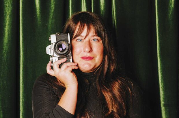 Heather Daenitz holding camera