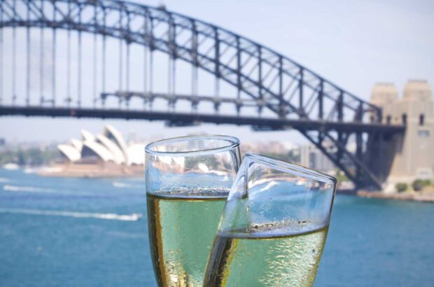 Champagne glasses in front of Sydney Harbour Bridge