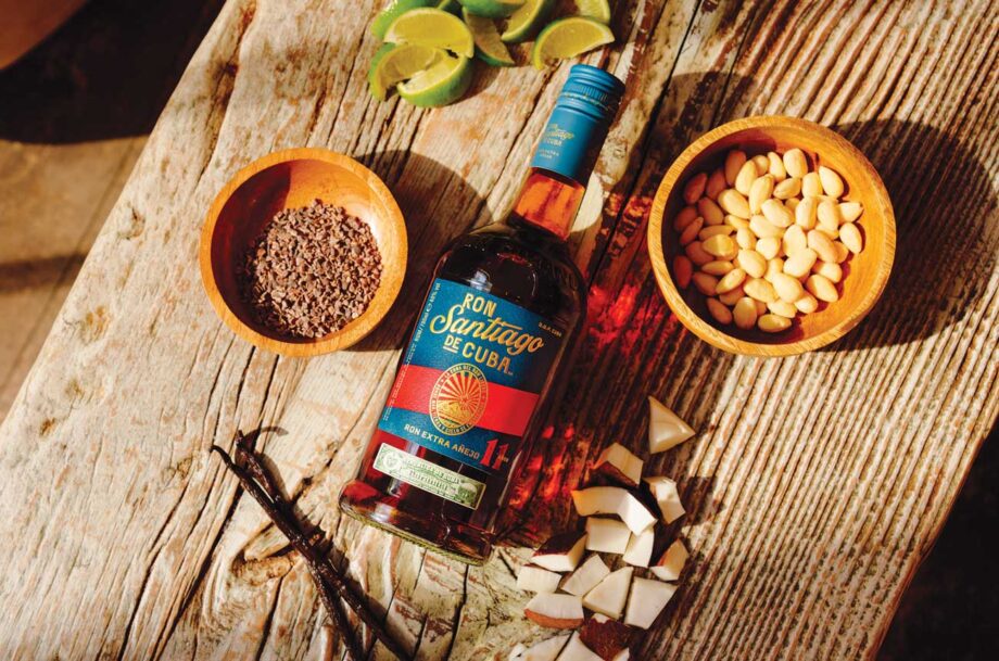 Bottle of Ron Santiago de Cuba Extra Añejo 11 Años on table with spices