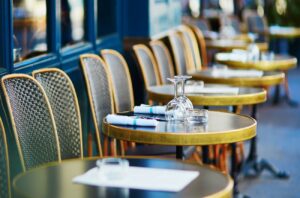 Glasses on a table of cozy Parisian outdoor cafe