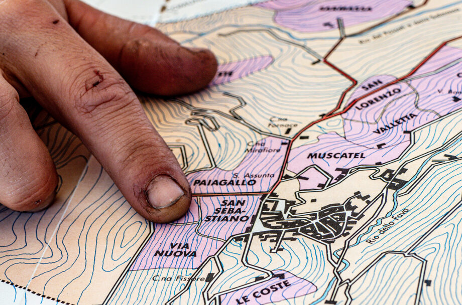 Prandi in Roddi Finger pointing at map of Barolo