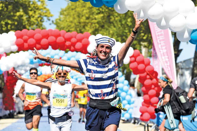 Crossing the Marathon du Médoc finish line.
