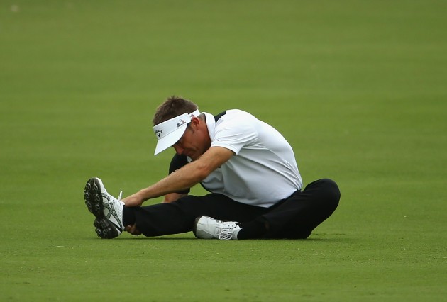 Stuart Appleby stretches on the fairway