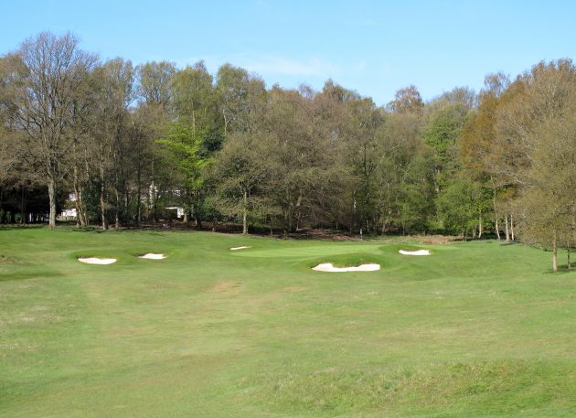 The par-3 11th - bunkers lead the eye, but not the ball, to the hole