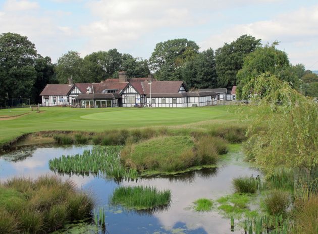 The scenic closing hole is protected by a pond